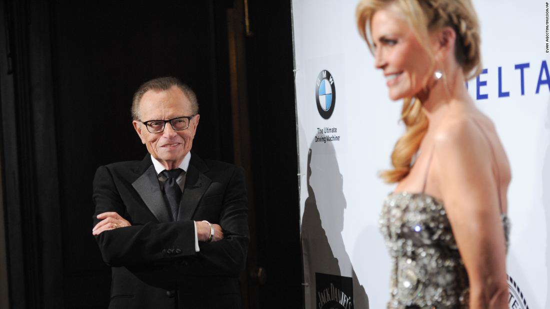 King watches his wife, Shawn, at a red-carpet event in 2014.