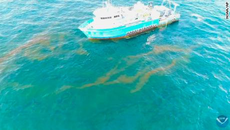 This September 2018 photo provided by NOAA shows a NOAA research vessel at a Taylor Energy production site in the Gulf of Mexico. A federally led study of oil seeping from the damaged platform found releases lower than other recent estimates, but contradicts the well owner&#39;s assertions about the amount and source of oil.