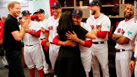 Britain's Prince Harry and Meghan, Duchess of Sussex meet Boston Red Sox players before a match against the New York Yankees in London, Saturday June 29, 2019. (Peter Nicholls/Pool via AP)