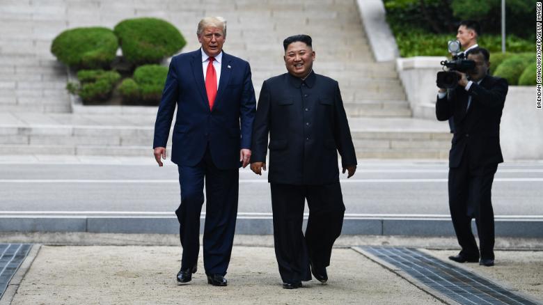 Kim Jong Un walks with Donald Trump at the DMZ dividing the Koreas on June 30, 2019.