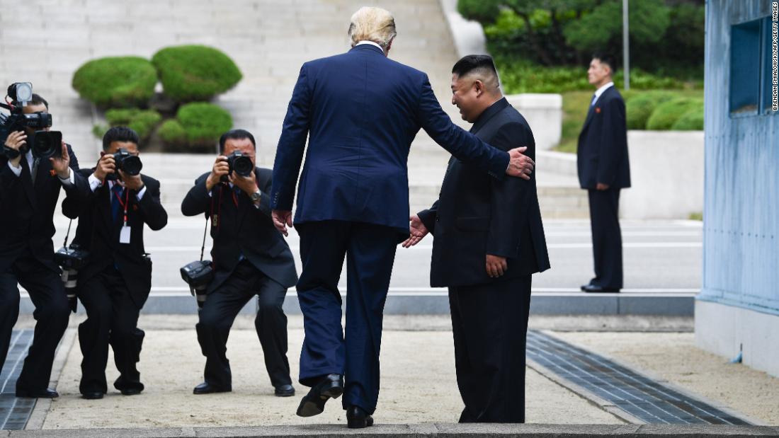 Trump steps onto the northern side of the Military Demarcation Line that divides North and South Korea, on Sunday, June 30, as Kim looks on.