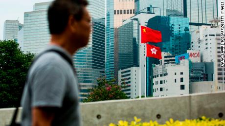 The Chinese and Hong Kong flags are seen outside the Legislative Council in Hong Kong on November 4, 2017. 
