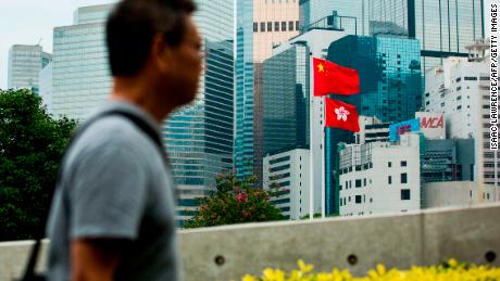 The Chinese and Hong Kong flags are seen outside the Legislative Council in Hong Kong on November 4, 2017. 