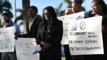 Marleine Bastien, center, protests with residents and activists against the Magic City plans.  