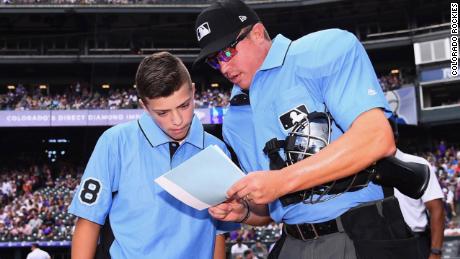 Josh Cordova met with MLB umpires at Sunday's Rockies game.