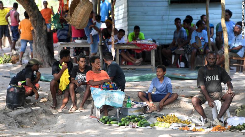 Locals are seen selling fruit in Tubusereia Village on November 4, 2017 in Central Province, Papua New Guinea.  