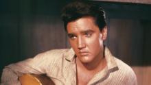 Who can resist this portrait of Elvis Presley holding an acoustic guitar, circa 1956?