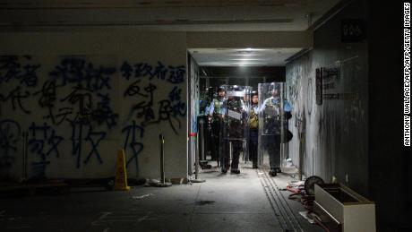 Police arrive after protesters stormed the government headquarters hours before in Hong Kong early on July 2, 2019.