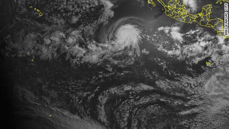 A satellite captured a powerful hurricane and a solar eclipse at the same time