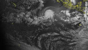 A satellite captured a powerful hurricane and a solar eclipse at the same time