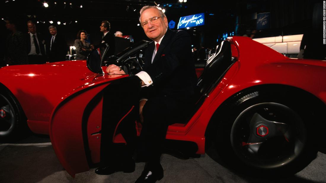 Seated in a convertible, Chrysler Corporation CEO Lee Iacocca, on tour to promote high quality American cars.  (Photo by Rick Maiman/Sygma via Getty Images)
