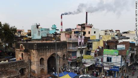 In this photograph taken on April 6, 2015, smoke billows from two smoke stacks at the coal-based Badarpur Thermal Station in New Delhi. A study by the Centre of Science and Environment in India found the plant which produces 705 MW (Megawatts) is one of the country&#39;s most polluting and inefficient power plants. Authorities insist they must focus on meeting the growing needs of its 1.25 billion people, 300 million of whom lack access to electricity. In its action plan for the Paris COP21 meet, India pledges to reduce its carbon intensity -- a measure of a country&#39;s emissions relative to its economic output -- by 35 percent by 2030, rather than an absolute cut in emissions. 
Globally, India is the third largest carbon-emitting country -- though its per capita emissions are only one third of the international average -- according to the World Resources Institute.  AFP PHOTO / MONEY SHARMA 