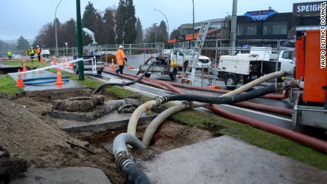 Pumps and sandbags are used to stem the flow of wastewater into Lake Taupo.