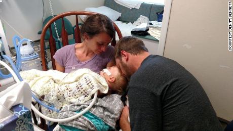 Jenny and Adam Bennett comfort their son, Jackson, while he was on life support at a Houston hospital in 2016. 
