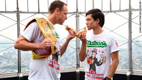 Defending men&#39;s champion Joey Chestnut, left, and former champion Matt Stonie during the contest weigh-in on Wednesday at the Empire State Building in New York. (Photo by Evan Agostini/Invision/AP)