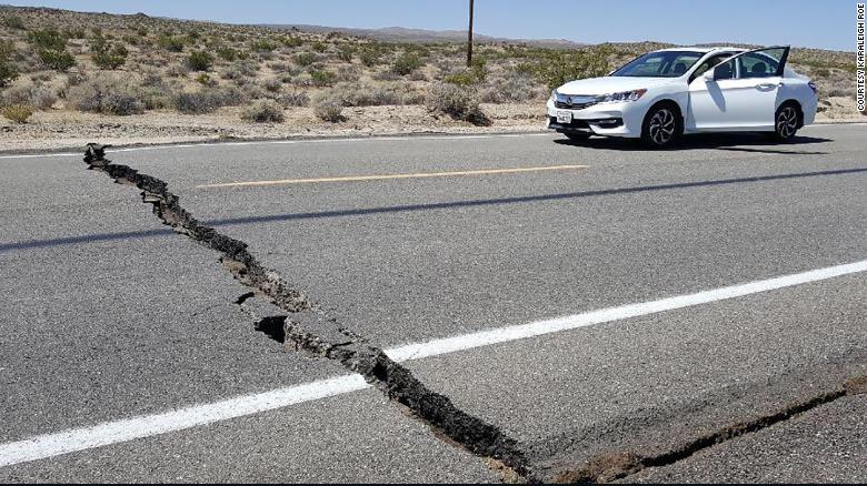 A crack in the road is seen near Ridgecrest, California after Thursday&#39;s quake.