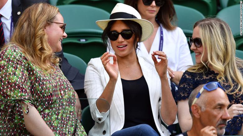 Britain&#39;s Meghan, Duchess of Sussex (center) watches Serena Williams at Wimbledon.