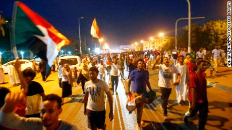 Sudanese protestors celebrate in the streets of Khartoum after ruling generals and protest leaders announced they have reached an agreement on the disputed issue of a new governing body on July 5, 2019. - The landmark agreement came after two days of talks following the collapse of the previous round of negotiations in May over who should lead the new ruling body -- a civilian or soldier. &quot;The two sides agreed on establishing a sovereign council with a rotating military and civilian (presidency) for a period of three years or little more,&quot; African Union mediator Mohamed El Hacen Lebatt told reporters. 