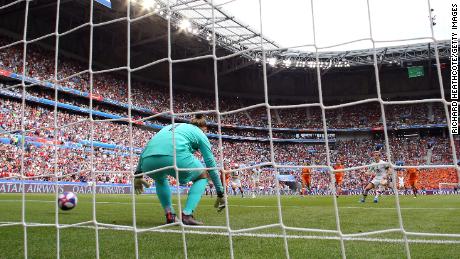 LYON, FRANCE - JULY 07: Megan Rapinoe of the USA scores her team&#39;s first goal from the penalty spot past Sari Van Veenendaal of the Netherlands during the 2019 FIFA Women&#39;s World Cup France Final match between The United States of America and The Netherlands at Stade de Lyon on July 07, 2019 in Lyon, France. (Photo by Richard Heathcote/Getty Images)