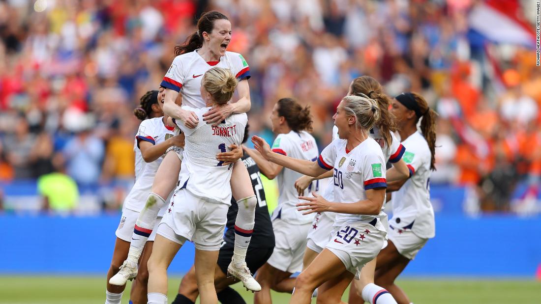 US players celebrate after the final whistle.