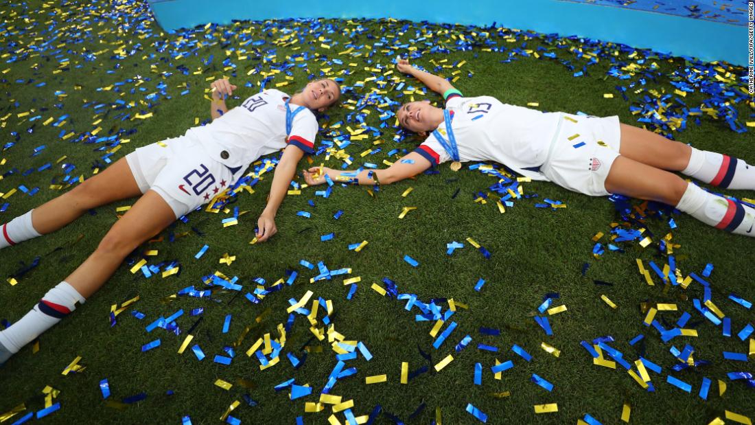 Allie Long, left, and Alex Morgan celebrate in the postgame confetti.