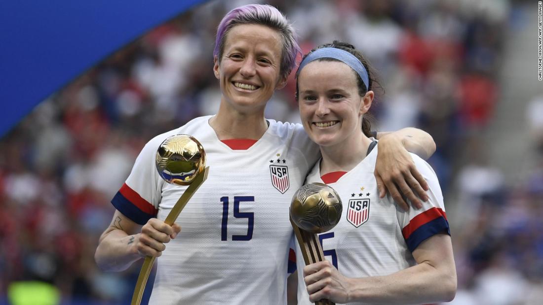 Megan Rapinoe poses with the Golden Ball next to Rose Lavelle with the Bronze Ball.