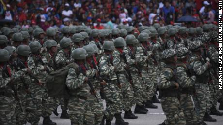 Members of the National Army march during a Venezuela Independence Day military parade in Caracas, Venezuela, on Friday, June 5, 2019. 