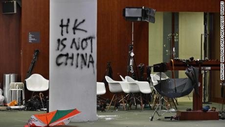 Hong Kong protesters stormed the Legislative Council on July 1, 2019, leaving graffiti and umbrellas.