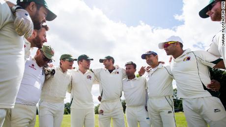Members of Graces Cricket team huddle before the start of their match on Sunday, June 16, in 