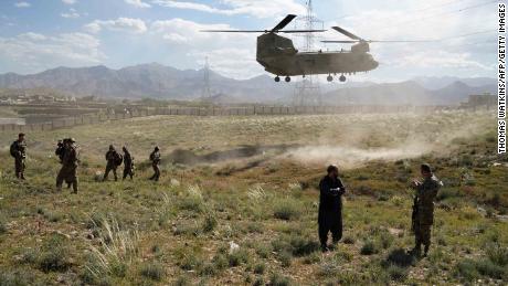 In this photo taken on June 6, 2019, a US military Chinook helicopter lands on a field outside the governor&#39;s palace during a visit by the commander of US and NATO forces in Afghanistan, General Scott Miller, and Asadullah Khalid, acting minister of defense of Afghanistan, in Maidan Shar, capital of Wardak province. - A skinny tangle of razor wire snakes across the entrance to the Afghan army checkpoint, the only obvious barrier separating the soldiers inside from any Taliban fighters that might be nearby. (Photo by THOMAS WATKINS / AFP) / To go with &#39;AFGHANISTAN-CONFLICT-MILITARY-US,FOCUS&#39; by Thomas WATKINS        (Photo credit should read THOMAS WATKINS/AFP/Getty Images)