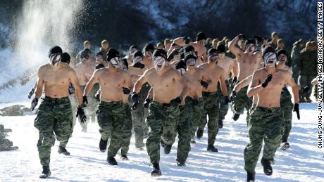 South Korean marines participate in winter endurance exercises. The country&#39;s military fosters a hypermasculine attitude among its mostly conscripted recruits. 