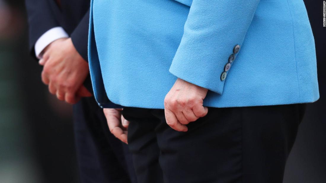 The hands of Merkel and Finnish Prime Minister Antti Rinne are seen as they listen to national anthems in Berlin in July 2019. Merkel's body &lt;a href=&quot;https://edition.cnn.com/2019/07/10/europe/angela-merkel-shaking-third-time-grm-intl/index.html&quot; target=&quot;_blank&quot;&gt;visibly shook again,&lt;/a&gt; raising concerns over her health. She said she was fine and that she has been &quot;working through some things&quot; since she was first seen shaking in June.