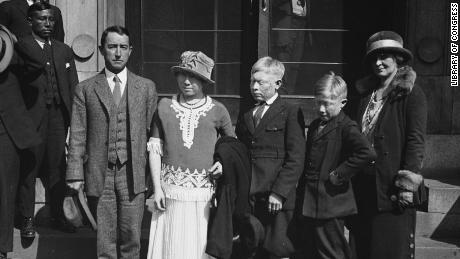 American explorer Richard Marsh poses with three &quot;white Indians&quot; he discovered in Panama and brought with him to Washington in 1924. 