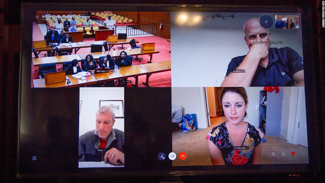 The Hurley family watches the sentencing on their laptop with advocate Annie Clark, bottom right, and members of London&#39;s Metropolitan Police.