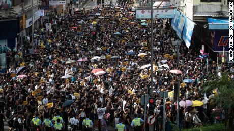 Hong Kong police called for demonstrators to &quot;leave peacefully&quot; after scuffles developed between protesters and police.
