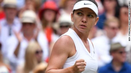 Romania&#39;s Simona Halep gives a fist pump after winning a point on the way to taking the opening set against Serena Williams in the women&#39;s singles final at Wimbledon. 