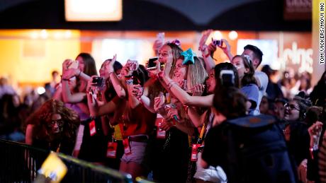 Fans cheering at VidCon. 