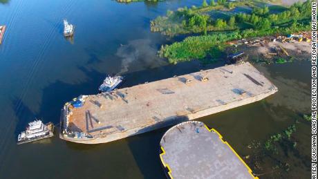 A sunken barge in Bayou Chene, meant to reduce flood risk, measures 400 feet long, 100 feet wide and 20 feet tall.