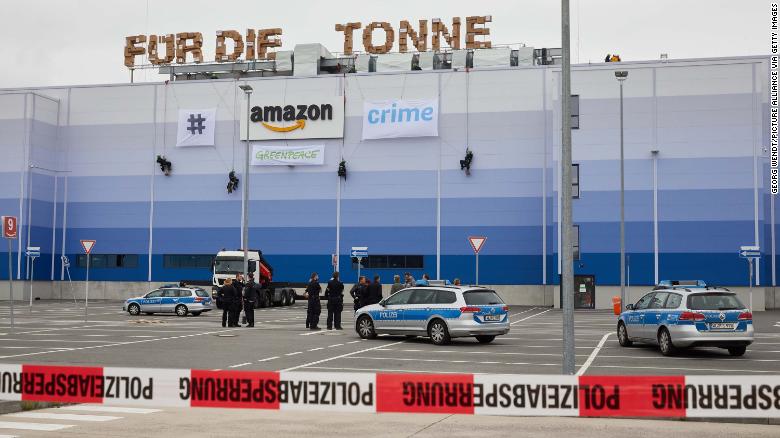 Greenpeace activists abseil down the Amazon Logistik Winsen GmbH building, protested against the destruction of returned new goods ahead of &quot;Prime-Day&quot;.