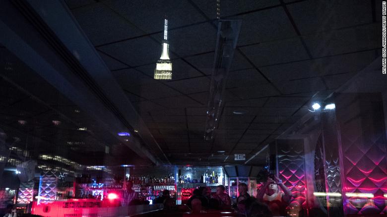 People wait in a Manhattan diner during a massive power outage that hit parts of New York City on July 13, 2019.