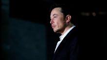 CHICAGO, IL - JUNE 14: Engineer and tech entrepreneur Elon Musk of The Boring Company  listens as Chicago Mayor Rahm Emanuel talks about constructing a high speed transit tunnel at Block 37 during a news conference on June 14, 2018 in Chicago, Illinois. Musk said he could create a 16-passenger vehicle to operate on a high-speed rail system that could get travelers to and from downtown Chicago and O'hare International Airport under twenty minutes, at speeds of over 100 miles per hour. (Photo by Joshua Lott/Getty Images)