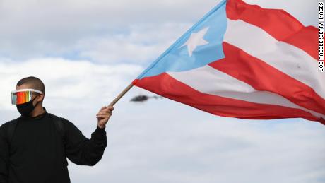 Reggaeton Singer Bad Bunny joins a protest in San Juan, Puerto Rico on Wednesday.