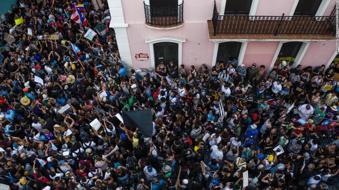 Protesters take to the streets of San Juan on July 15.