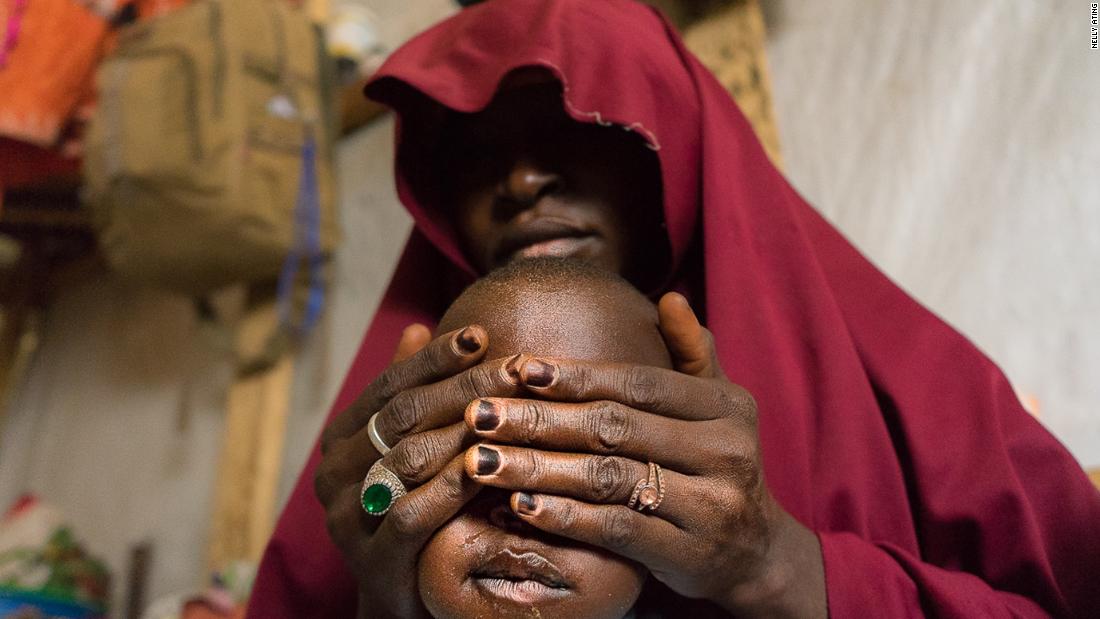 Falamatu, 35, with her son. She gave up her 12 year old daughter, Innakaru to marry a Boko Haram foot soldier. "The insurgents had seized my hometown Bama in Borno State. I live in regret, I pray my daughter Innakaru is safe and will forgive me"- Maiduguri, 2018