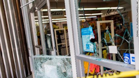 A department store&#39;s windows are broken Thursday, after protests the previous night in San Juan, Puerto Rico.