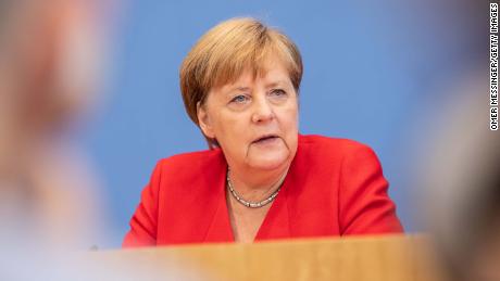 Angela Merkel stands in &#39;solidarity&#39; with congresswomen attacked by Trump