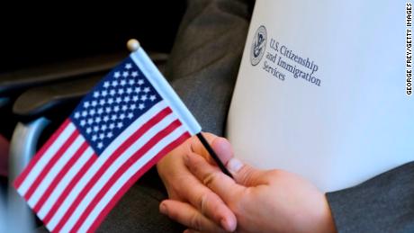 SALT LAKE CITY, UT - APRIL 10: An applicant holds an American flag and a packet while waiting to take the oath to become a U.S. citizen at a Naturalization Ceremony on April 10, 2019 in Salt Lake City, Utah. There were 49 people from 26 countries that became U.S. citizens. A group of Republican Senators are introducing a bill today to reduce legal immigration in the United States. (Photo by George Frey/Getty Images)