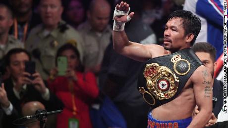 Manny Pacquiao sports another belt in his legendary boxing career. 