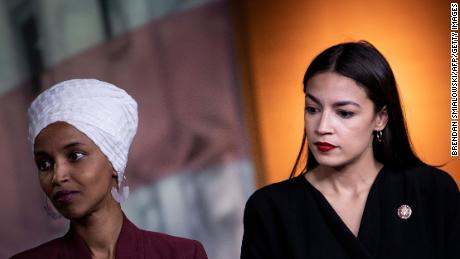 Democratic Reps. Ilhan Omar of Minnesota, at left, and Alexandria Ocasio-Cortez, at right, of New York listen during a press conference in July 2019.