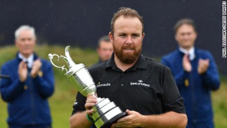 Shane Lowry cradles the Claret Jug for winning the Open. 